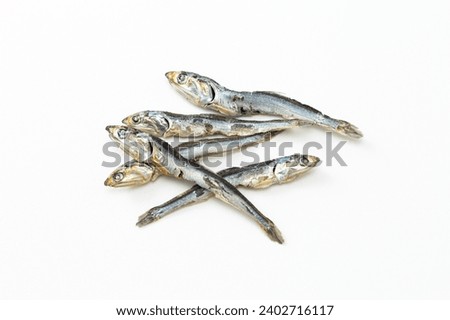 Dried sardines on a white background.