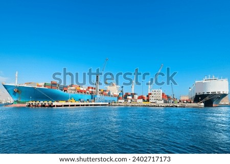 Containers being loaded Unloaded in a cargo ship at the port of Iquique, Chile.