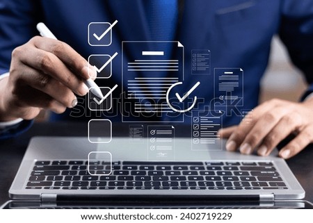 Business performance monitoring and evaluation concept, Take an assessment, Business man using laptop and tablet online checklist survey, Filling out digital checklist, Questionnaire with checkboxes.