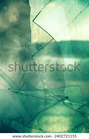 windows smashing. Cubic abstractionism (orthogonality in object art) artistic endeavour, nogging art. But artistic fantasy: behind sharp form you can see dull sun,old wall and dusty fields. Desolation Royalty-Free Stock Photo #2402721155