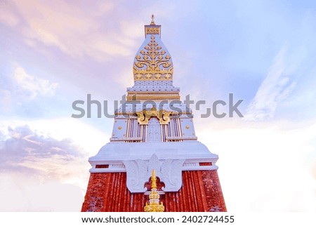 That Phanom, Buddhist architecture The building is decorated with golden stucco designs and has a spire. Sacred things in Isaan Thailand