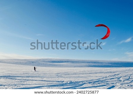Snowkiting, winter, white desert, north Royalty-Free Stock Photo #2402725877