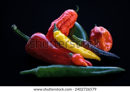 A packet of different types of chili peppers Royalty-Free Stock Photo #2402726579