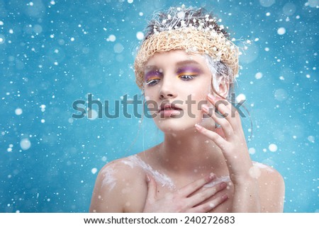 Winter beauty young woman portrait,model creative image with frozen makeup, with porcelain skin and long white lashes showing trendy, Ice-queen, Snow Queen, Easter