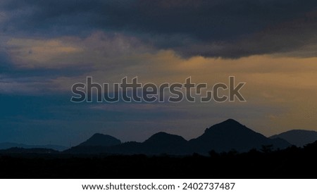 Misty morning light in Sri Lanka mountain landscape. Golden color sunset moment. Beauty nature view with blue sky. Top peak mount