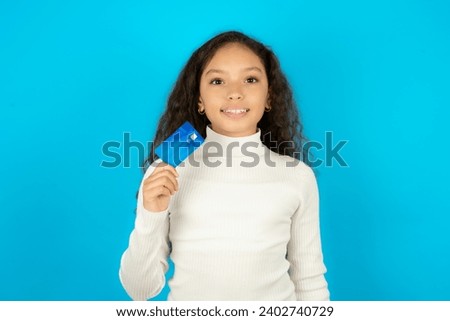Photo of happy cheerful smiling positive Young beautiful teen girl recommend credit card