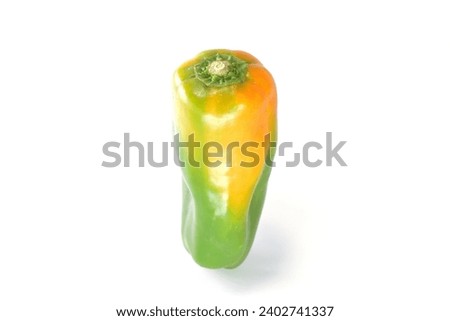 Discolored substandard green pepper white background Royalty-Free Stock Photo #2402741337