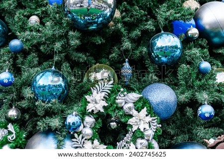 Christmas tree background close up shot with nice decorative  toys for Xmas and new year celebration.