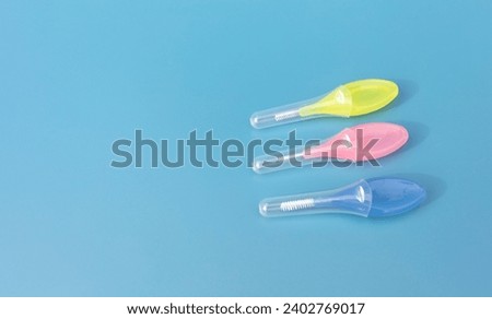Mockup Colorful Interdental Toothbrush For Cleaning Between Teeth On Blue Background . Toothpick With Soft Bristles, Oral Tooth Cleaning Tool. Horizontal, Copy Space For Text. Dental And Orthodontic. Royalty-Free Stock Photo #2402769017