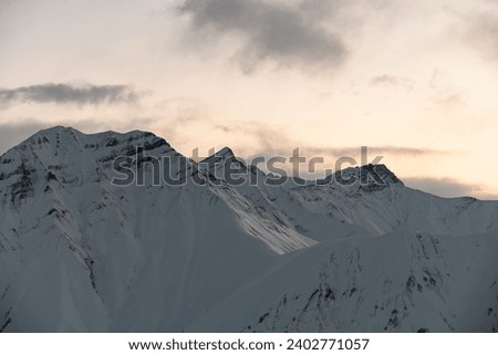 Beautiful photo of snow-covered mountain slopes, a morning landscape in the mountains for lovers of active recreation