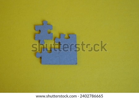 Puzzles sign of Team work with yellow background