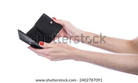 Wallet in female hand isolated on white background. Female wallet. High quality photo