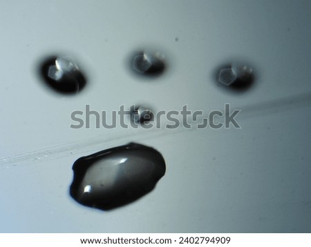 water droplets on black background with focus on the center