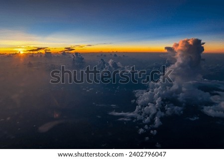 Aerial view of majestic sunset behind high cumulus clouds. High quality photo
