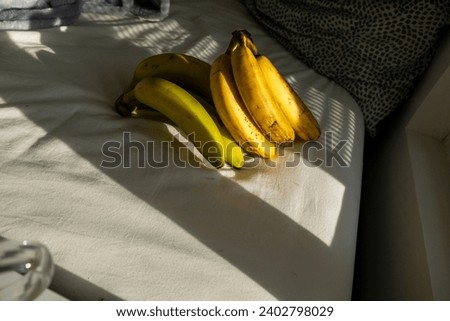 bananas in dark spots on fabric with shadows