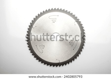 circular saw blade close-up. circular saw isolated on white background. Royalty-Free Stock Photo #2402805793