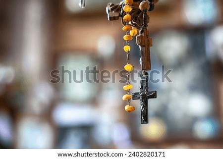 Interior of a Catholic chapel with a cross and rosary. Jesus.