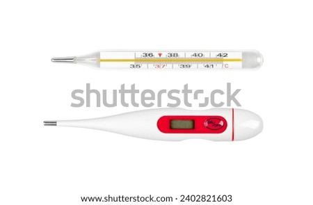 Classic traditional old glass mercury thermometer and a digital electronic one, two different objects isolated on white background, cut out, top view. Temperature measurement instrument simple concept Royalty-Free Stock Photo #2402821603