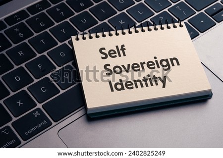There is notebook with the word Self Sovereign Identity. It is as an eye-catching image. Royalty-Free Stock Photo #2402825249