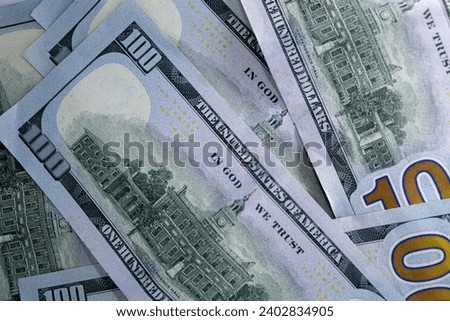  Close up view of one hundred dollar bills isolated on white background.