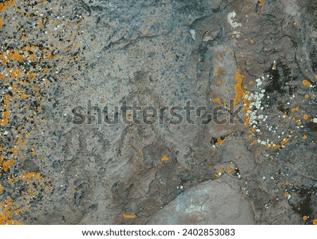 Carved on flat stones, drawings of ancient artists depicting a person. Khakassia, Siberia, Russia.