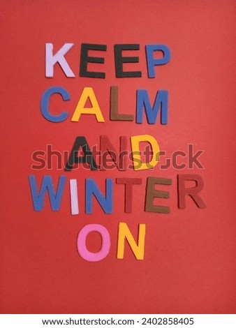 keep calm and winter on sign on a red background 