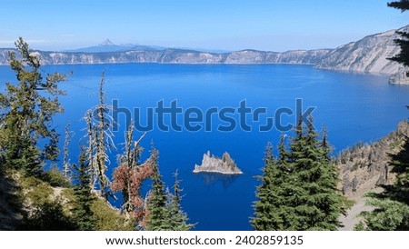 View of Crater Lake and the Phantom Ship rock formation at Crater Lake National Park, Oregon Royalty-Free Stock Photo #2402859135