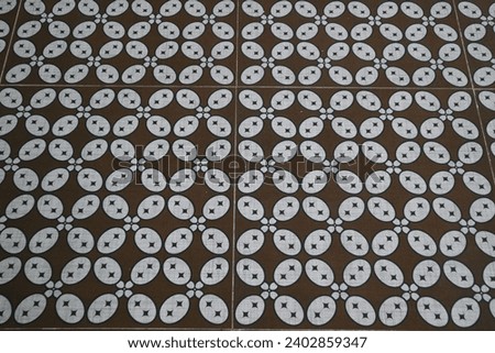 kawung batik motif on the ceramic floor of a building