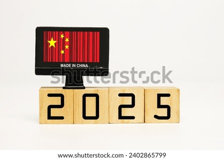 A picture of toy screen monitor with 2025 wooden block on white background.