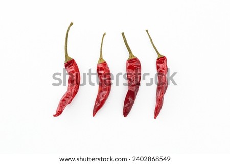 Chili pepper on a white background. Royalty-Free Stock Photo #2402868549
