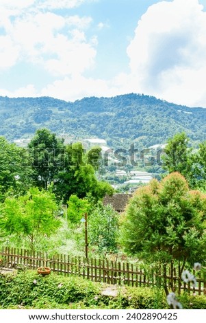 Picture of Mountain landscape with sky,and trees with beautiful scene of greenery on mountains.