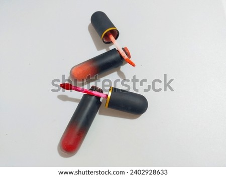 Two various shade of lipstick isolated on white background.