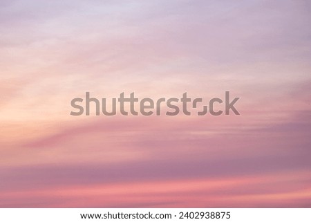 A beautiful sky tinted by the sun leaving vibrant shades of gold, pink, blue and multicolored. Clouds in the twilight evening and morning sky. Image of a cloudy sky in the evening, and during the day