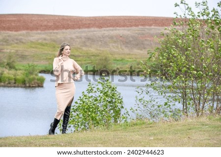 Autumn gracefully poses on the shore of a picturesque lake for photo shoots. Capture memorable moments with a fall photo shoot accompanied by picturesque landscapes.