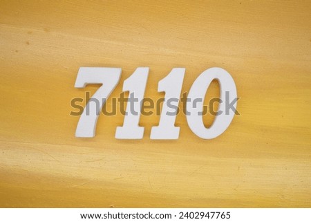 The golden yellow painted wood panel for the background, number 7110, is made from white painted wood.