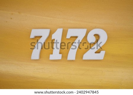 The golden yellow painted wood panel for the background, number 7172, is made from white painted wood.