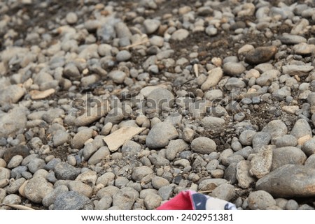 rocks in a riverside during the day in the city of Jakarta, Indonesia