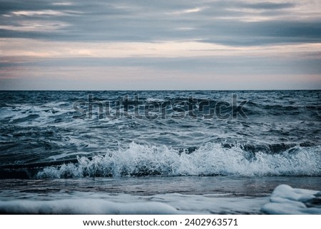 Stormy Mediterranean sea water landscape photo. Beautiful nature scenery photography with evening on background. Idyllic scene. High quality picture for wallpaper, travel blog