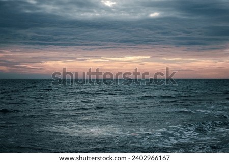 Winter Mediterranean sea waves landscape photo. Peaceful sunset time. Beautiful evening scenery photography. Calm waves during vacation. High quality picture for wallpaper, travel blog, article