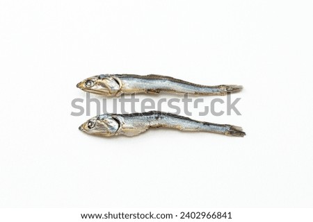 Dried sardines on a white background.