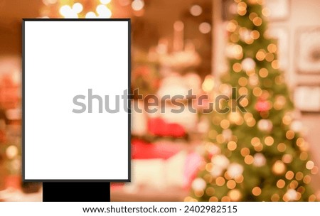 mockup white poster with black frame stand in front of blur Christmas decoration in departure shopping mall background for show or present promotion product concept