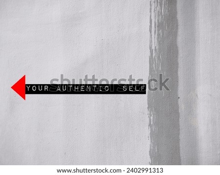 Direction on wall point to Your Authentic Self - means AUTHENCITY or self discovery - who you really are deep down, when your words, actions, behaviors consistently match core identity Royalty-Free Stock Photo #2402991313