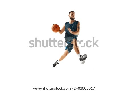 athleticism of basketball player in uniform, engaged in rigorous training routine before championship against white background. Concept of sport, hobby, active lifestyle, power and strength. Ad