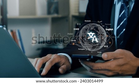 Businessman holding a smartphone to Translation of foreign languages on mobile app.Symbol of translation.Ai translator.Mobile app worldwide language conversation.