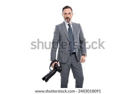 photojournalist man paparazzi photographer taking photo with camera isolated on white Royalty-Free Stock Photo #2403018091