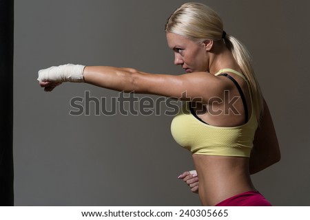 Young Woman Boxer MMA Fighter Practice Her Skills