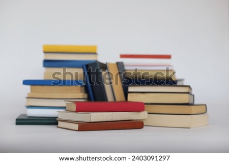 Stack of books on white education