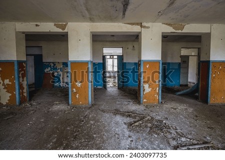 School in Illinci abandoned village in Chernobyl Exclusion Zone, Ukraine Royalty-Free Stock Photo #2403097735