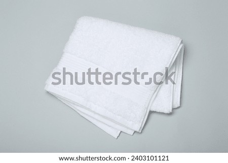 White terry towel on light grey background, top view Royalty-Free Stock Photo #2403101121