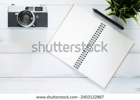 Minimal work space - Creative flat lay photo of workspace desk. White office desk wooden table background with mock up notebooks and retro camera. Top view with copy space, flat lay photography